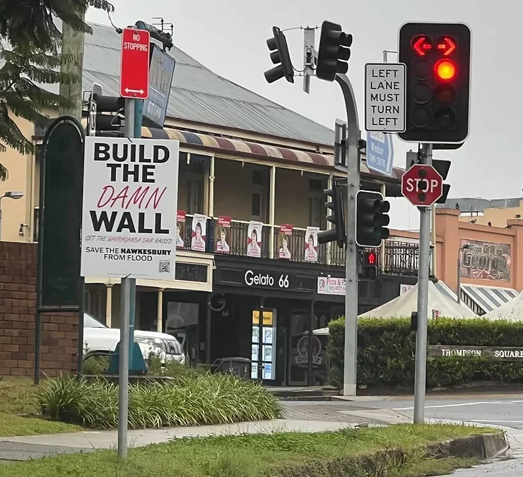 Group pushing to raise the dam wall illegally flypost signs across the Hawkesbury